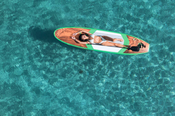istock Girl on stand up paddle, SUP board paddling 2197859798