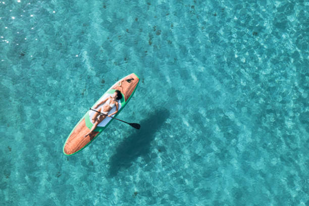 istock Girl on stand up paddle, SUP board paddling 2197859804