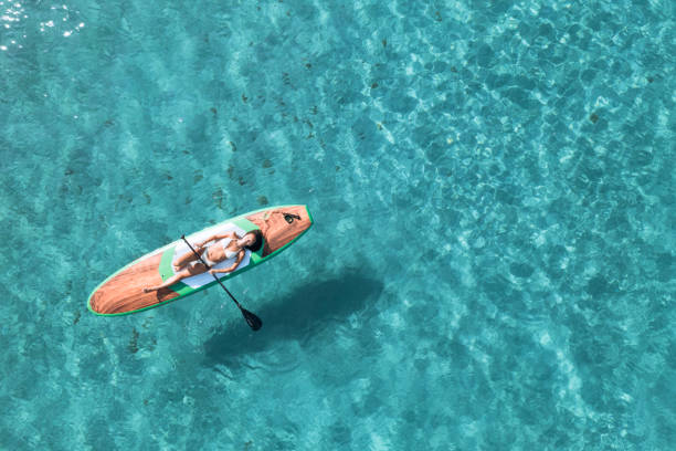 istock Girl on stand up paddle, SUP board paddling 2197859807