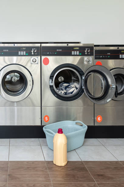 istock Laundry service shop with automatic washer and dryer 2197861366