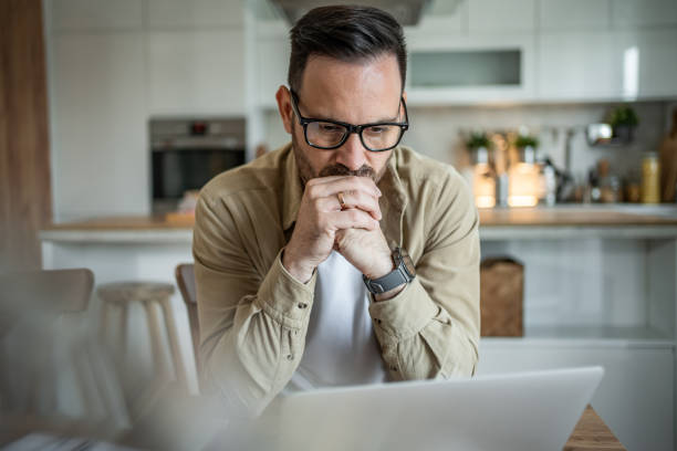 istock Serious businessman working from home 2197863304