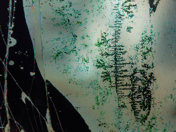 istock Close-up of broken LCD LED screen showing pixel distortion and texture, creating a digital drama effect. 2197863477