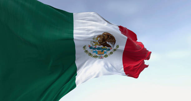 istock Mexico national flag waving on a clear day 2197866362