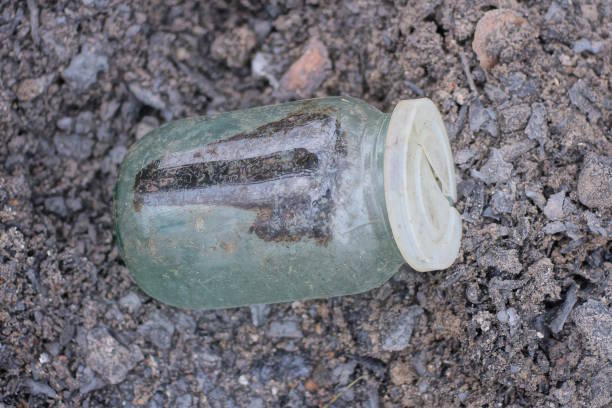 istock one old dirty glass jar stands on the gray ground 2197870466