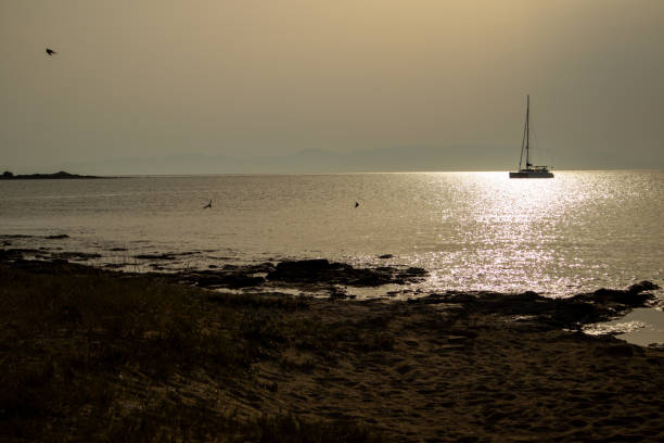 Sailboat boat on the horizon in the Peloponnese Islands in Elafonisos