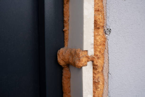 istock Insulation installation detail showing foam application on building exterior 2197876276