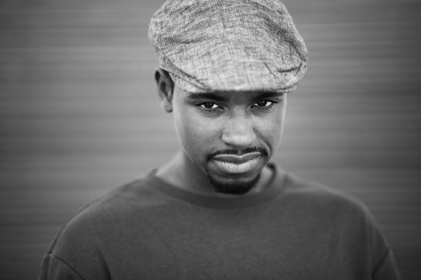 istock Black and white portrait of cool young black guy with cap 2197877266