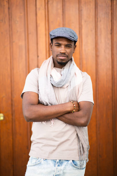 istock Handsome young african man with cap and scarf 2197877320
