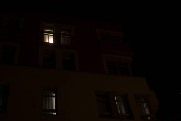 istock A tall building filled with numerous windows is beautifully lit up at night 2197879372