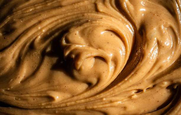 istock Velvety swirl of peanut butter. 2197882143