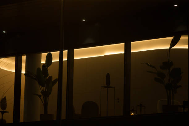istock A building that has numerous windows illuminates its surroundings at night 2197884561