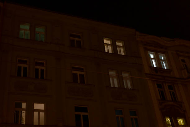 istock A tall building featuring numerous windows shines brightly at night 2197893887