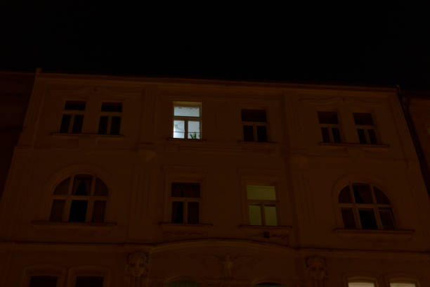 istock A multistory building with numerous windows is illuminated at night 2197894254