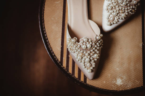 Many stylish jewelry, shoes and accessories on pink background, flat lay