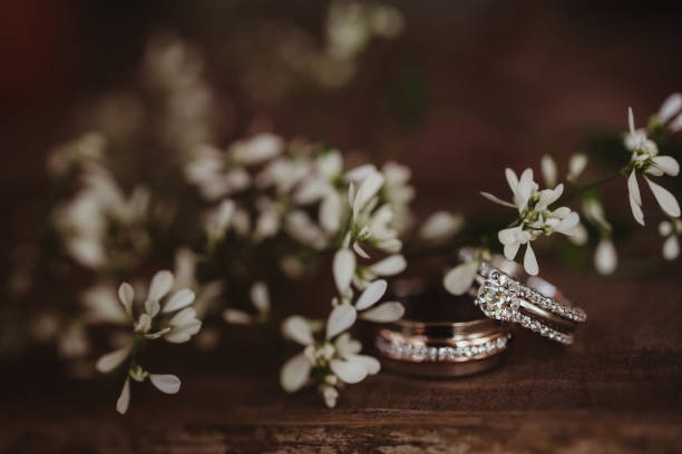 istock Wedding rings with white flower background 2197894351