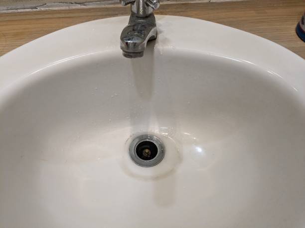 istock white sink in public toilet 2197894420