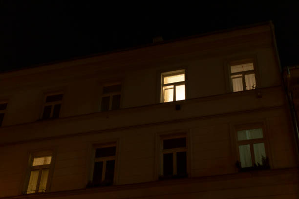 istock A tall building that has numerous windows is beautifully lit up at night 2197895904