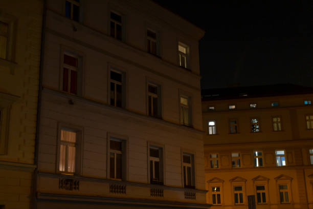 istock A tall building with many windows is beautifully lit at night 2197898085