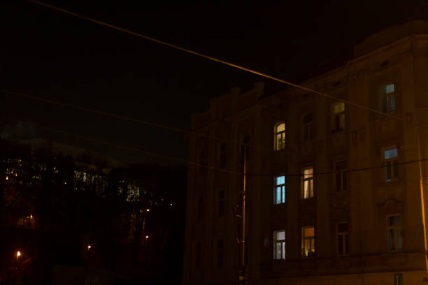 istock A tall building, featuring many windows, is beautifully illuminated at night 2197898166