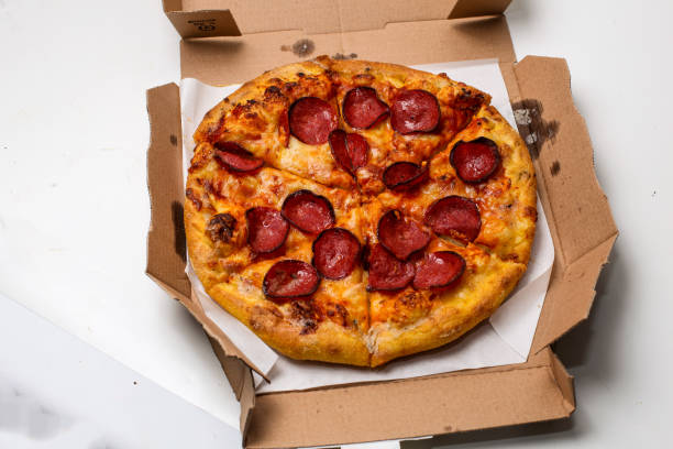 istock Pepperoni pizza in a box with white background, good for article, recipe, or commercial 2197898609