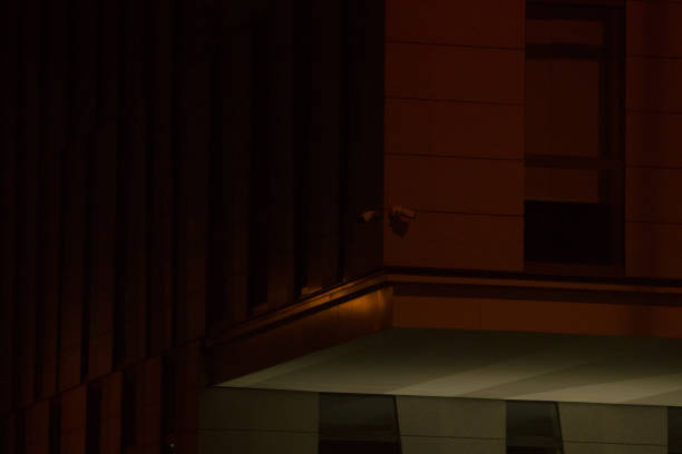 istock CCTV security camera is situated on wall in the dark evening 2197899184