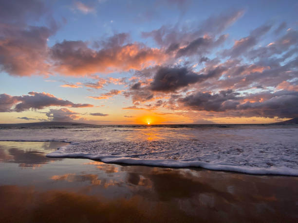 istock Sunset Over Ocean Waves on a Maui Beach 2197899307