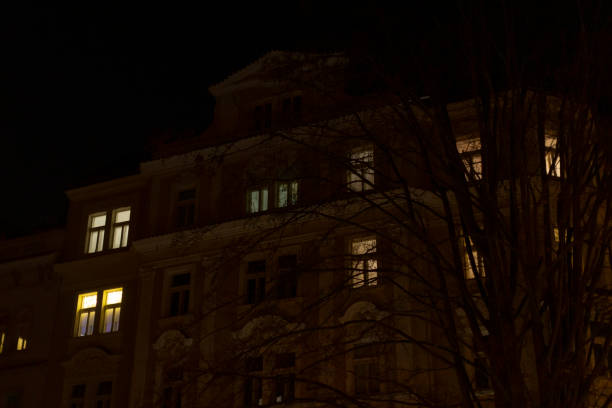 istock A tall building with many windows brightly lit up during the night 2197899742