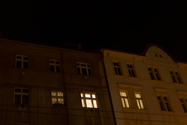 istock A large building with numerous windows illuminated brightly at night 2197902796