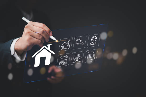 istock Modern digital interface showing real estate elements with businessman hand pointing stylus pen at house icon virtual screen financial analysis dashboard property technology 2197902957