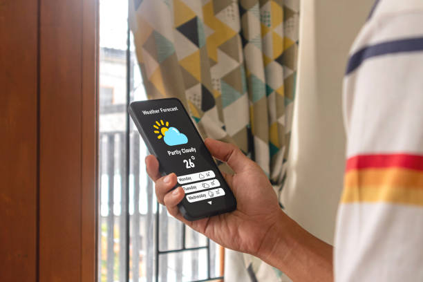 istock A man at home checking the weather forecast using an app on his smartphone 2197904130