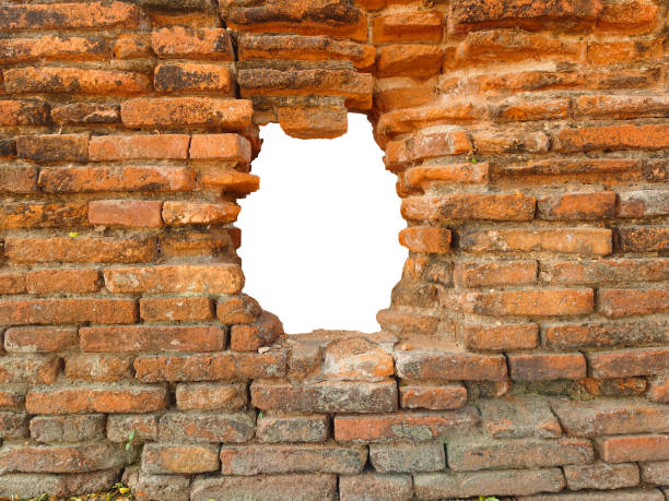 istock Hole in the ancient brick wall, ancient red brick texture. 2197905950