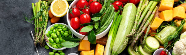 istock Delicious raw fruits and vegetables on  background. 2197907311