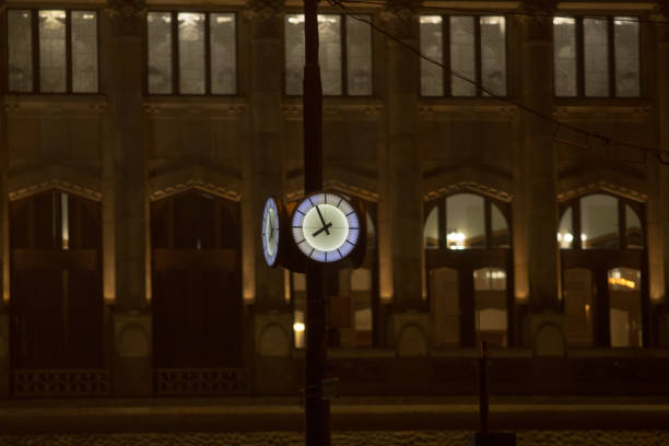 istock Urban clock prominently displayed in cityscape. symbol of order and structure. 2197908531