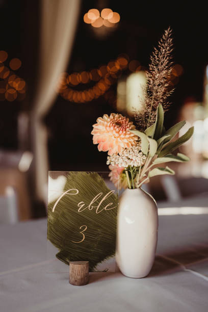 istock Elegant wedding reception table number sign with flower centerpiece 2197911560