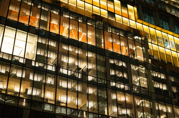 Office building at night with illuminated windows, New York City