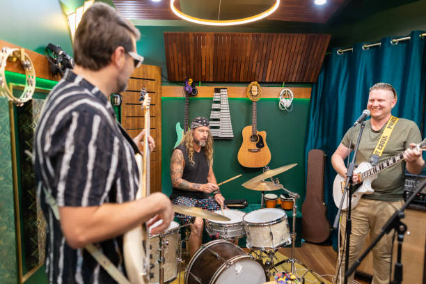 istock Middle aged men playing music together 2197914550
