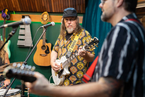 istock Middle aged men playing music together 2197914580