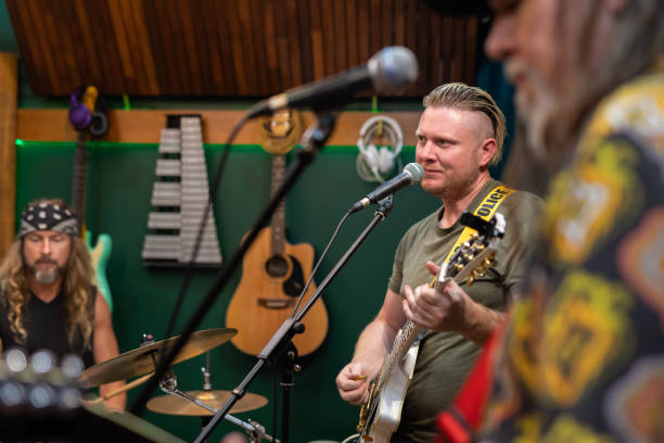 istock Middle aged men playing music together 2197914583