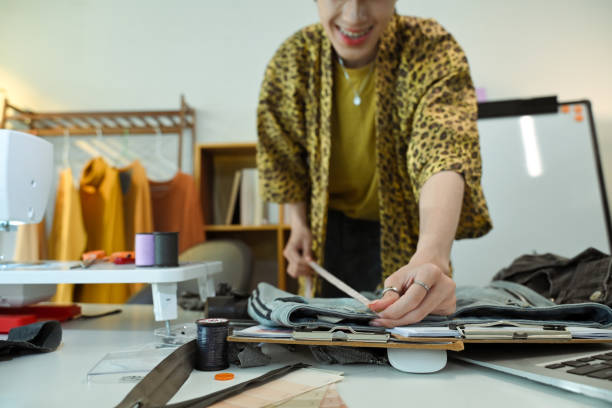 istock Stylish tailor working on a new garment design in a fashion studio 2197917411