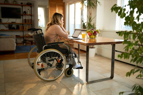 istock Disabled woman feeling bored while working on laptop at home. 2197917592