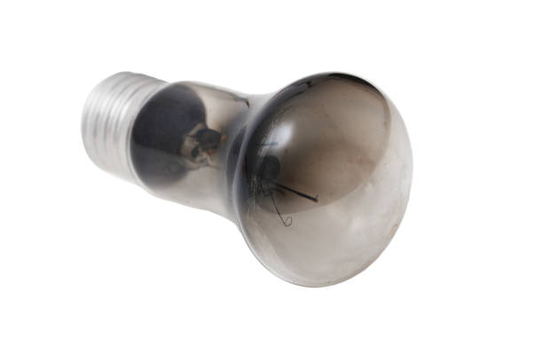 istock A black light bulb is sitting on a white background 2197918822
