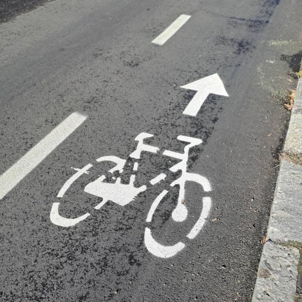 istock Bicycle symbol on asphalt road 2197921437
