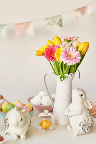 istock Easter composition with sweet bread, Easter cake, eggs, bouquet of flowers. Holidays breakfast concept with copy space. Traditional easter cake with gingerbread cookies. Easter Greeting Card Template 2197922344