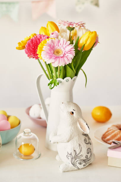 istock Easter composition with sweet bread, Easter cake, eggs, bouquet of flowers. Holidays breakfast concept with copy space. Traditional easter cake with gingerbread cookies. Easter Greeting Card Template 2197922353