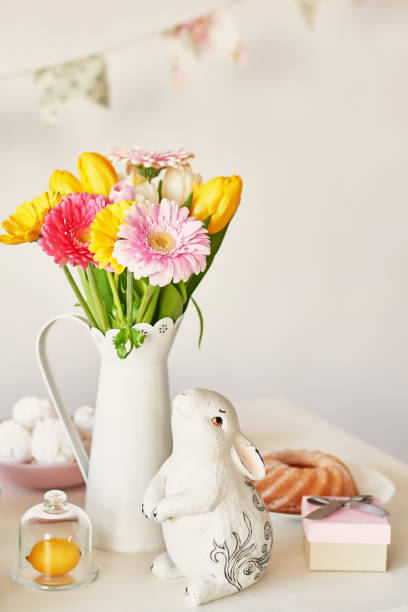istock Easter composition with sweet bread, Easter cake, eggs, bouquet of flowers. Holidays breakfast concept with copy space. Traditional easter cake with gingerbread cookies. Easter Greeting Card Template 2197922355