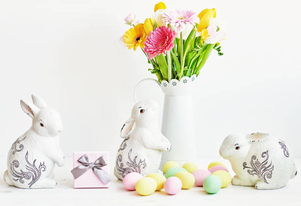 istock Easter composition with sweet bread, Easter cake, eggs, bouquet of flowers. Holidays breakfast concept with copy space. Traditional easter cake with gingerbread cookies. Easter Greeting Card Template 2197922532