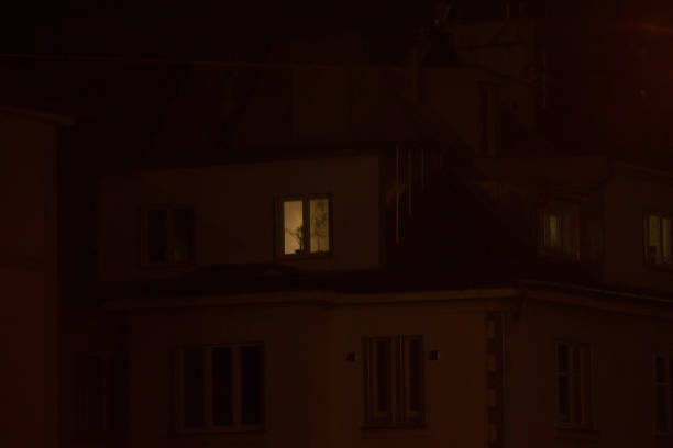 istock A Dimly Lit Building Window at Nighttime in an Urban City Setting 2197922719