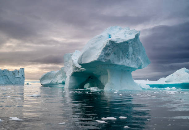 istock floating icebergs during a sunset in Disko Bay, during polar summer midnight solar season. Ilulissat, Greenland 2197923717