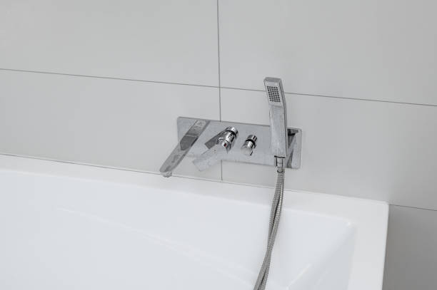 istock Shower head and water taps shiny clean chrome 2197926282