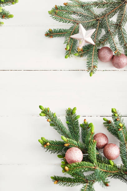 istock Christmas composition. Fir branches on wooden white background. Flat lay, top view, copy space. Christmas still life. Christmas frame made of fir branches and pink toys. Greeting card. Happy New Year 2197926284